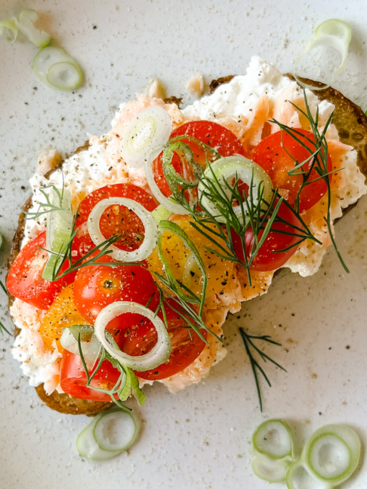 toast with tomatoes, cucumbers, scallions, smoken salmon